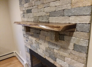 Sudbury MA Boston Blend Ledgestone - Live Edge Black Walnut Mantel Unmistaken Stonecraft MA and Southern NH fine masonry