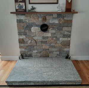 Woodstove surround Unmistaken Stonecraft MA and Southern NH thin stone veneer masonry